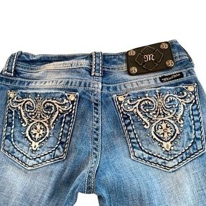 Miss Me low rise rhinestone bling embroidered pockets. Size 26, medium wash